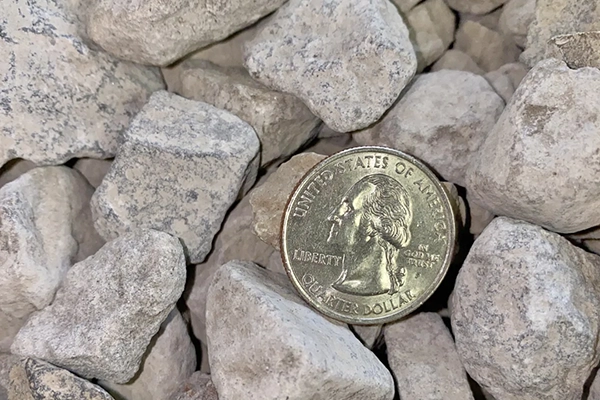 57 limestone with quarter to reflect size